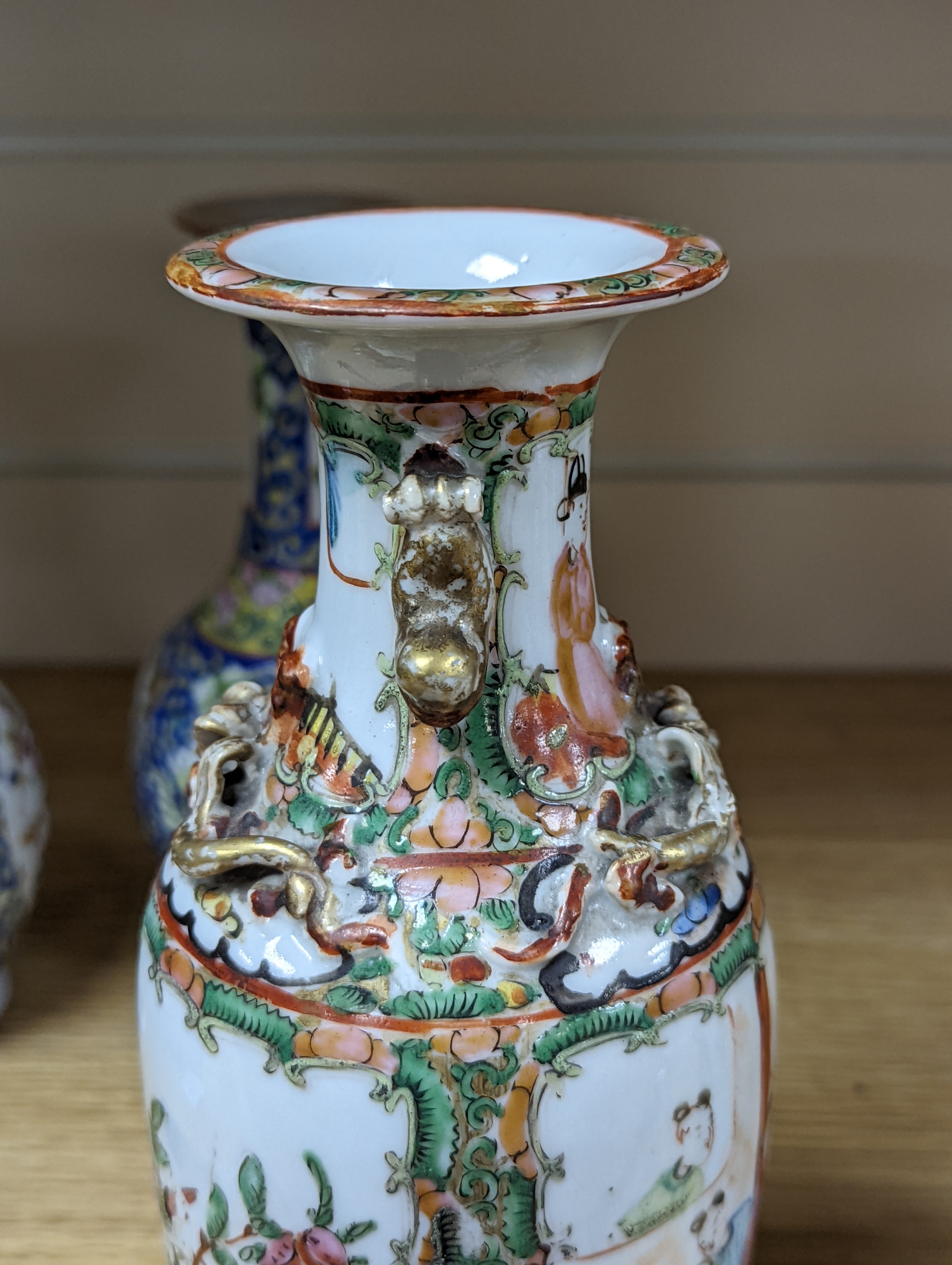 Four 19th century Chinese famille rose vases, 21cm